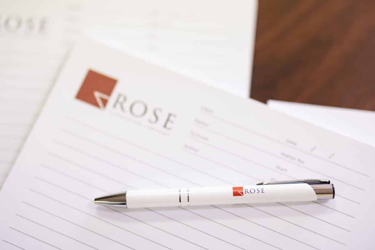 Rose Litigation Lawyers notepad and pen